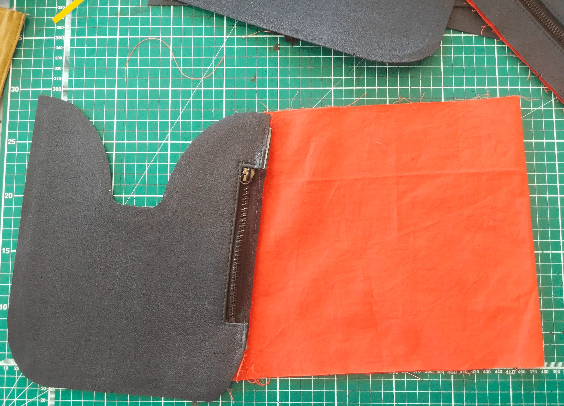 Leather flap and lining pinned with zipper
