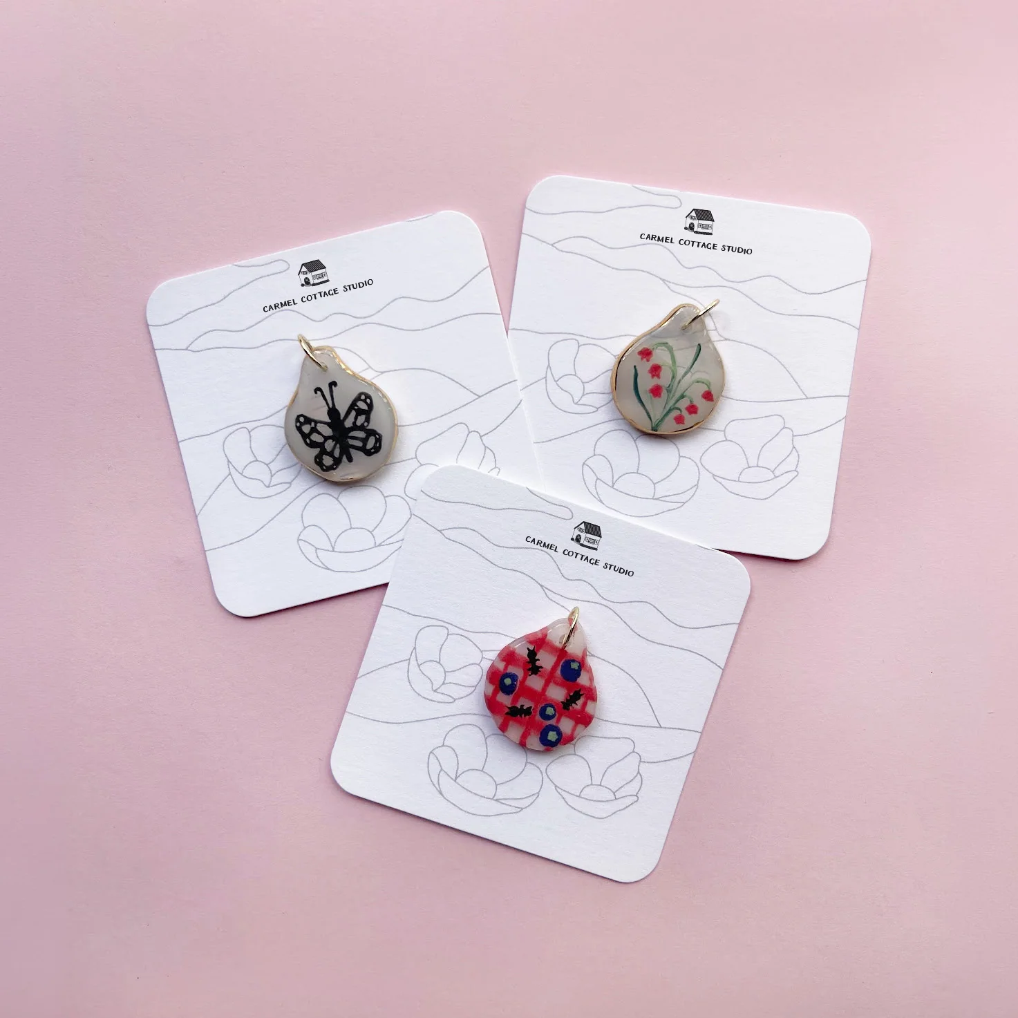 Pendants on branded backing cards