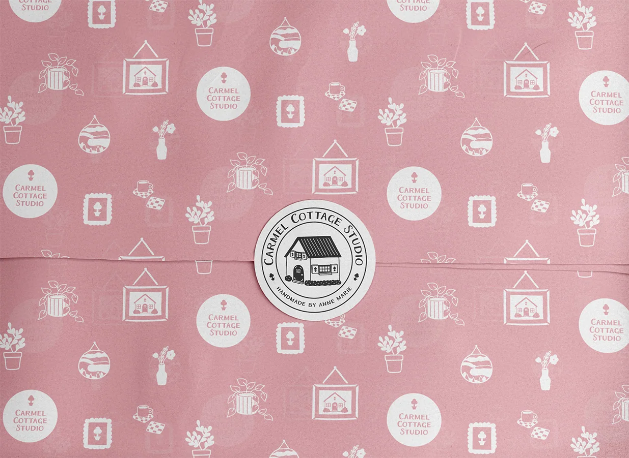 Branded tissue paper wrap sealed with a Carmel Cottage Studio sticker